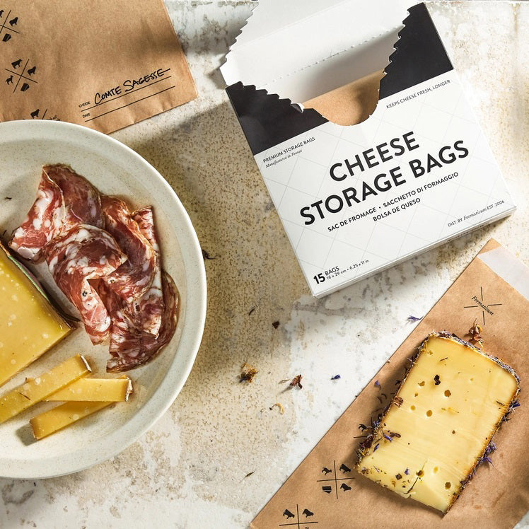 A white box labeled "FORMATICUM - CHEESE STORAGE BAGS" with cow, goat, and sheep icons. Includes 15 bags (6.25 x 11 in) for cheese storage at home; info available in multiple languages.
