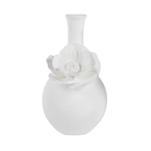The CAMEO LONG NECK PORCELAIN BUD VASE by ZODAX is a round, white vase with a matte finish, featuring a narrow neck and a detailed floral embellishment on the front.