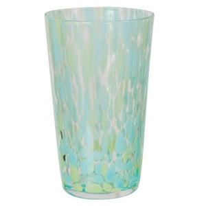 A selection of CREATIVE COOP HAND-BLOWN CONFETTI DRINKING GLASS tumblers, each with red, yellow, and pastel speckles, is displayed on a light surface; a tall glass holds drink stirrers and a cocktail recipe card.