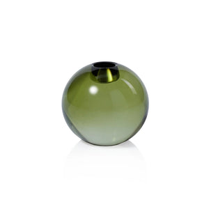 The ZODAX ROUND CRYSTAL GLASS TAPER HOLDER IN GREEN is a small, round, translucent green glass holder, 3.5" tall and 3.25" wide, with a narrow opening, shown against a plain white background.