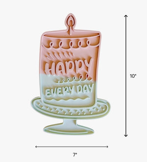 Introducing the HAPPY LICK MAT - PINK by BARKS & BROWNIES: a pastel cake-shaped slow feeder for dogs, labeled “Happy Every Day.” Crafted from BPA-free silicone, it features deep maze ridges for anxiety relief, a non-slip suction base, and is dishwasher safe for easy cleaning.