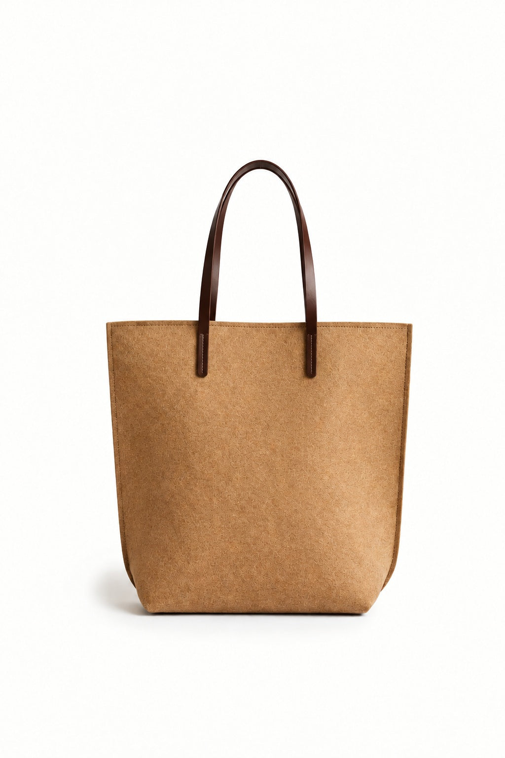 A person in a beige trench coat holds the WOOLBERRY WOOL FELT LONG TOTE BAG with black handles, standing against a plain, light-colored background.