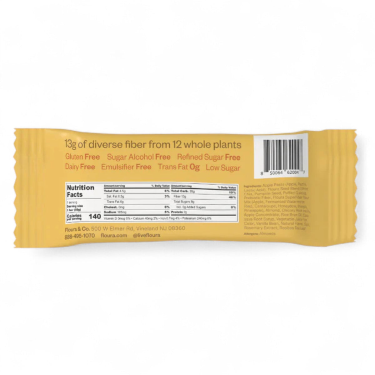 A yellow FLOURA &amp; CO wrapper labeled &quot;MANGO CARDAMOM FLOURA FIBER CRUSH BAR&quot; shows orange mango slices, with text highlighting &quot;Fruit Crush Bar,&quot; &quot;13g prebiotic fiber,&quot; and &quot;dairy and gluten free.