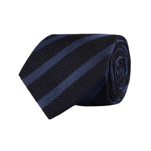 The AMANDA CHRISTENSEN Striped Jacquard Woven Silk Tie in Blue, featuring a black base with diagonal dark blue stripes, is showcased against a white background.