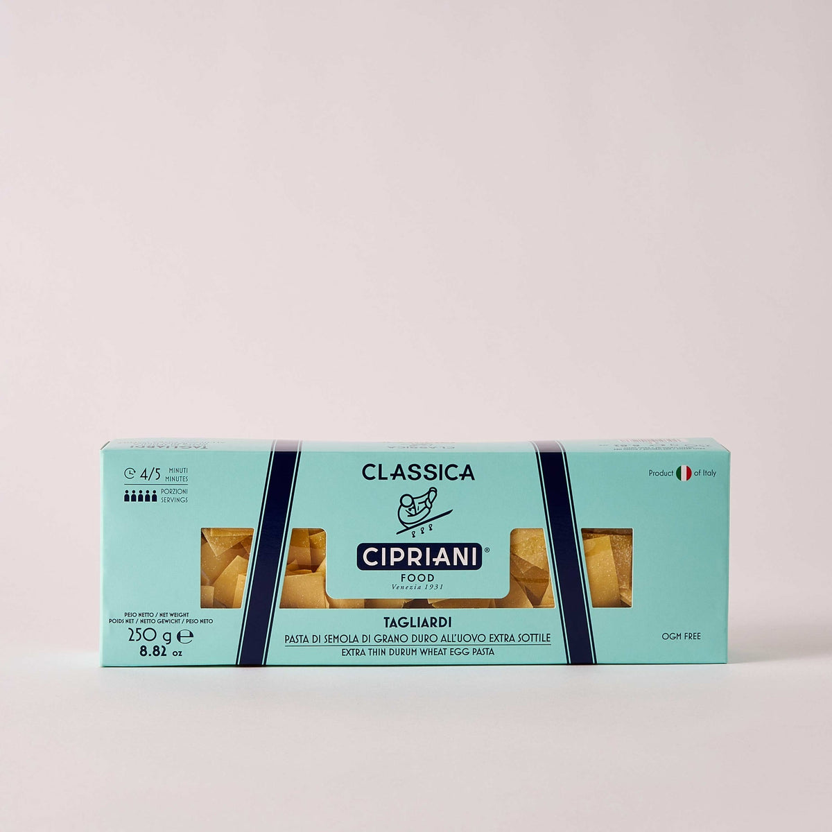 A light turquoise package of Cipriani - Organic Tagliardi Egg Pasta from Atalanta Corporation, weighing 250 grams (8.8 ounces), is displayed. The box features a clear window revealing the extra thin Durum wheat egg pasta inside, with text highlighting its GMO-free quality and that it&#39;s proudly made in Italy.