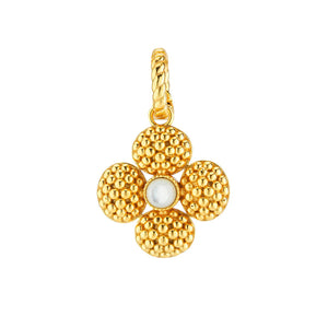 The CAPUCINE DE WULF BERRY CLOVER DOUBLE SIDED PENDANT features an elegant design with four oval mother-of-pearl stones around a central textured gold bead, all attached to a braided gold loop and adorned with intricate gold detailing.