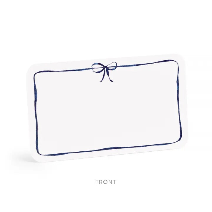 E. FRANCES PAPER’s LITTLE NOTES NAVY BOW is a rectangular white mini note card with a thin hand-drawn navy border and a small bow at the top—blank inside, ideal for any boxed set of Little Notes.