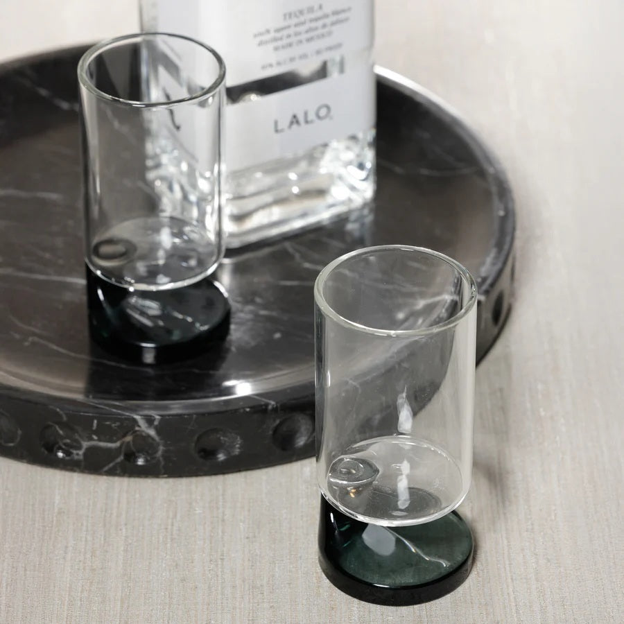 The ZODAX NAPOLI SHOOTER GLASS features a modern cylindrical clear body and a distinctive smoke base, shown against a white background.