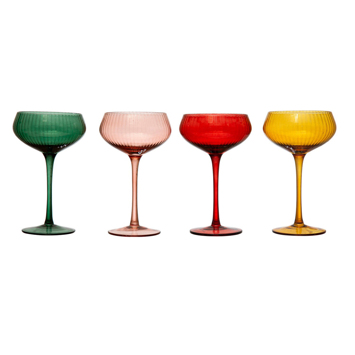 Four CREATIVE COOP STEMMED CHAMPAGNE GLASSES in assorted colors display festive tree and fruit-shaped paper decorations. Nearby, a pom-pom garland and open &quot;EAT&quot; and &quot;drink&quot; cards add to the cheerful table setting.