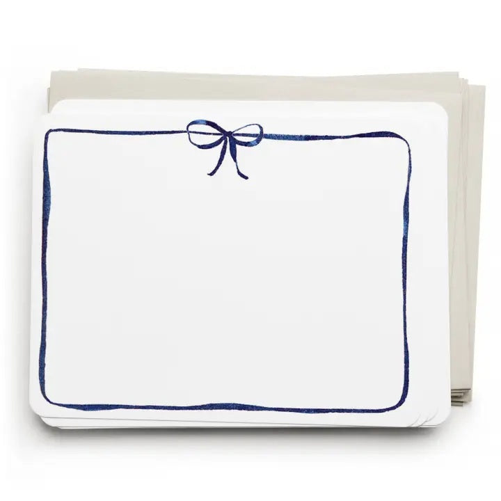 E. FRANCES PAPER's Flat Notes Navy Bow set includes illustrated notecards with matching envelopes, each featuring a blue border and navy bow. Partially boxed with a green band label—ideal for handwritten notes.