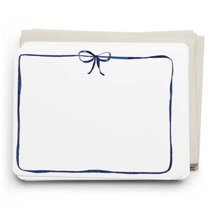 E. FRANCES PAPER's Flat Notes Navy Bow set includes illustrated notecards with matching envelopes, each featuring a blue border and navy bow. Partially boxed with a green band label—ideal for handwritten notes.