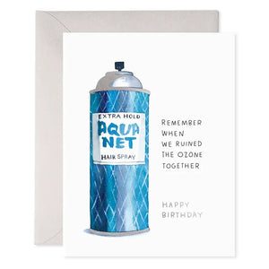 An E. FRANCES PAPER AQUANET BIRTHDAY CARD featuring three illustrated spray paint cans labeled "AQUANET" on a white background, with an envelope partially visible behind the card.