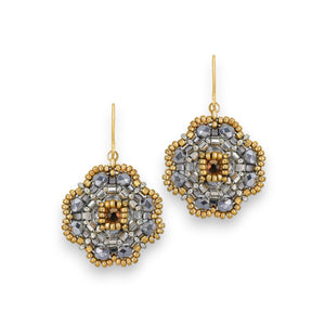 The MIGUEL ASES - MIYUKE CRYSTAL BEAD PYRITE EARRINGS by MIGUEL ASES, INC. showcase a geometrically artistic floral design with Miyuki crystal beading and a central gold bead, suspended from gold hooks and highlighted with subtle silver accents.
