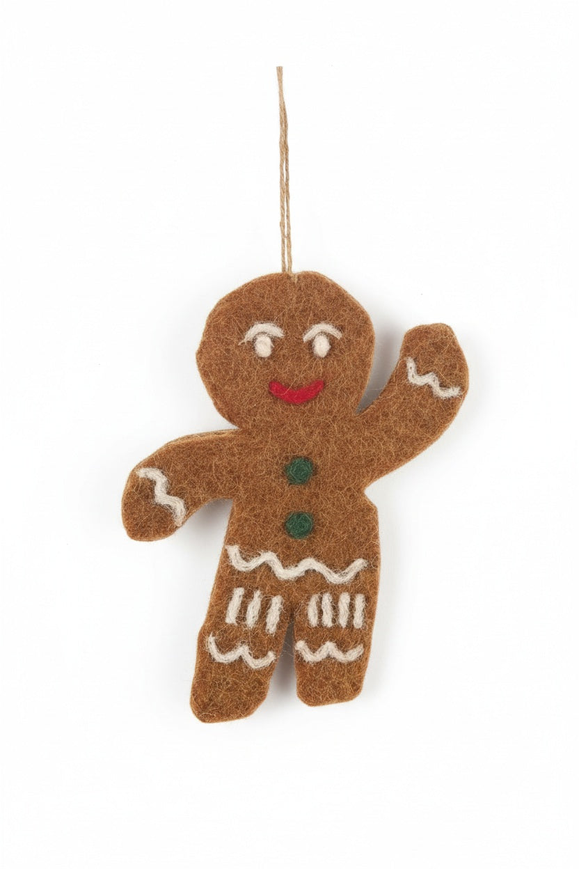 JOLLY GINGERBREAD MAN ORNAMENT by FELT SO GOOD, a handmade felt gingerbread man with a waving arm and a string loop for hanging.