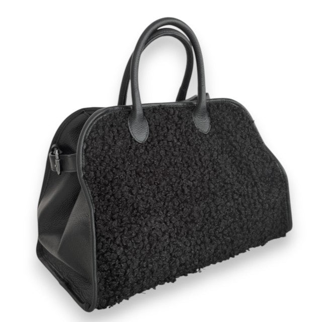 The VICARIO CINQUE - BORUSSIA HANDBAG by VICARIO CINQUE is shown on a white background, featuring a black bouclé-textured exterior on the sides and smooth leather handles.