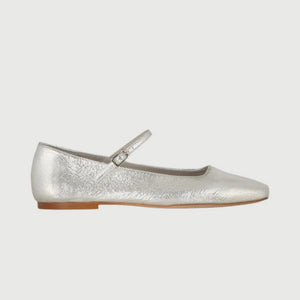 The AUGUSTA - JULIETA MARY JANE by AUGUSTA is a black leather flat shoe featuring a slender, adjustable strap across the top and a low wooden heel. With its renewed silhouette, slightly pointed toe, and minimalist design, this handcrafted Spanish shoe is presented against a plain, light gray background.