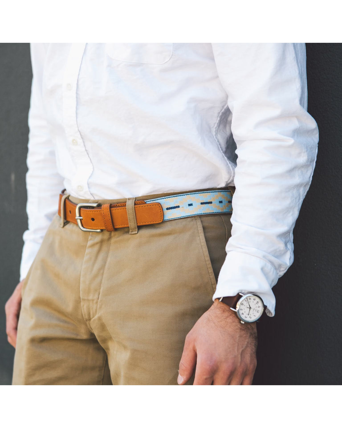 The LA MATERA - PINAMAR WOVEN BELT by LA MATERA features a full-grain leather strap, a silver buckle, and a beaded pattern in light blue, navy, and beige, offering durable premium craftsmanship and lasting style.
