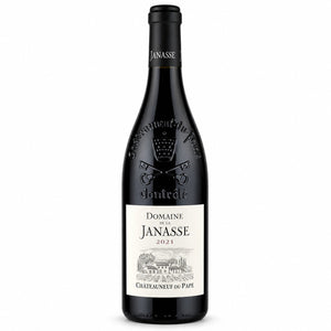 A bottle of JANASSE ‘TRADITION’ CHATEAUNEUF-DU-PAPE 2021 from WINE: FREEDOM BEVERAGE, featuring an embossed crest on the neck and a detailed illustration of a vineyard on the label.