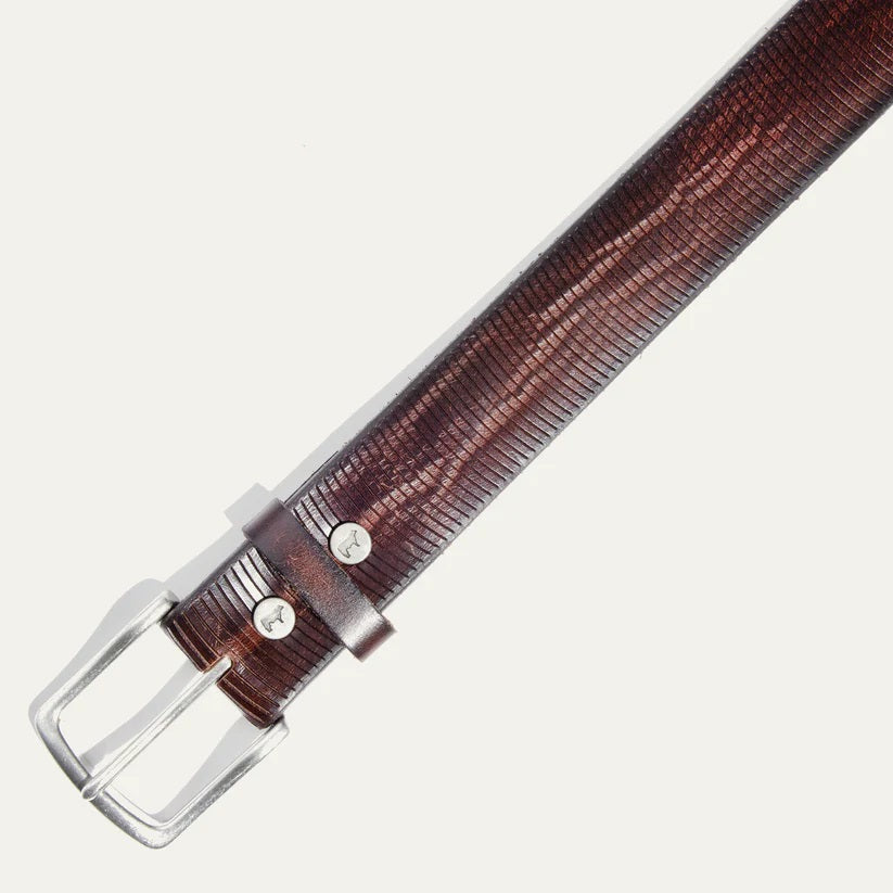 Close-up of the WILL LEATHER GOODS Embossed Crescent Belt in brown, handcrafted from full-grain leather with a silver buckle and two metal rivets, displayed on a white background.