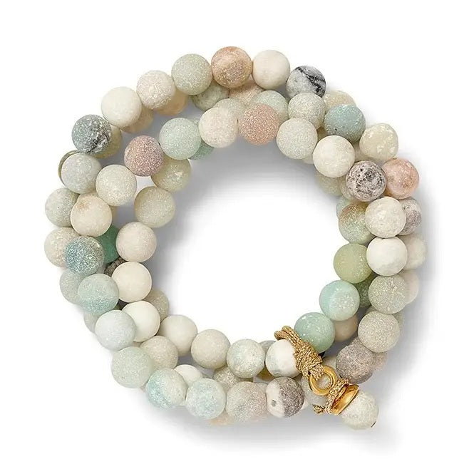 The CC & CO BY CATHERINE CANINO Beachy Sally Blue Druzy Quartz Beaded Bracelet features round, pastel-colored stones in white, green, and beige hues, accented with shimmering blue druzy quartz beads and finished with a gold clasp.