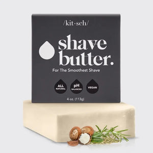 Labeled "KITSCH - SHAVE BUTTER," a black box rests on a cream soap bar with rosemary, shea nuts, and coconut, promoting sustainability and hydration. Features: "Reduces Single-Use Plastic," "Clear Shave," "All Natural," and "Vegan." Package weight is 4 oz (113g).