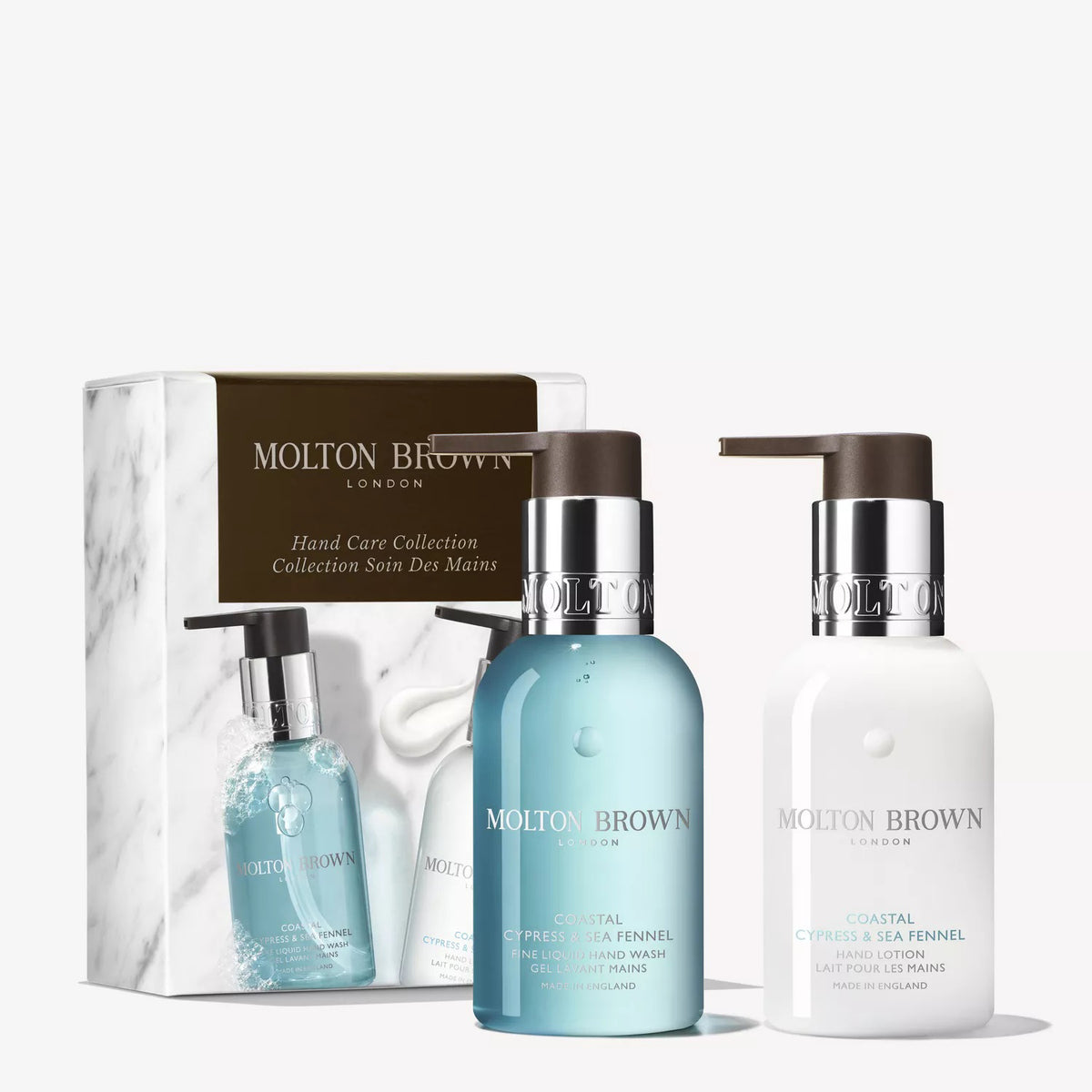 The MOLTON BROWN - COASTAL CYPRESS HAND COLLECTION includes a blue hand wash and white hand lotion with marine notes, both in pump dispensers, presented before their branded box.