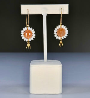 GOLDISH - Floral Gemstone Earrings in Pink Moonstone and White Pearl feature delicate 14K gold fill fringe beneath pink moonstones and white pearls, displayed on a white stand for an elegant look.