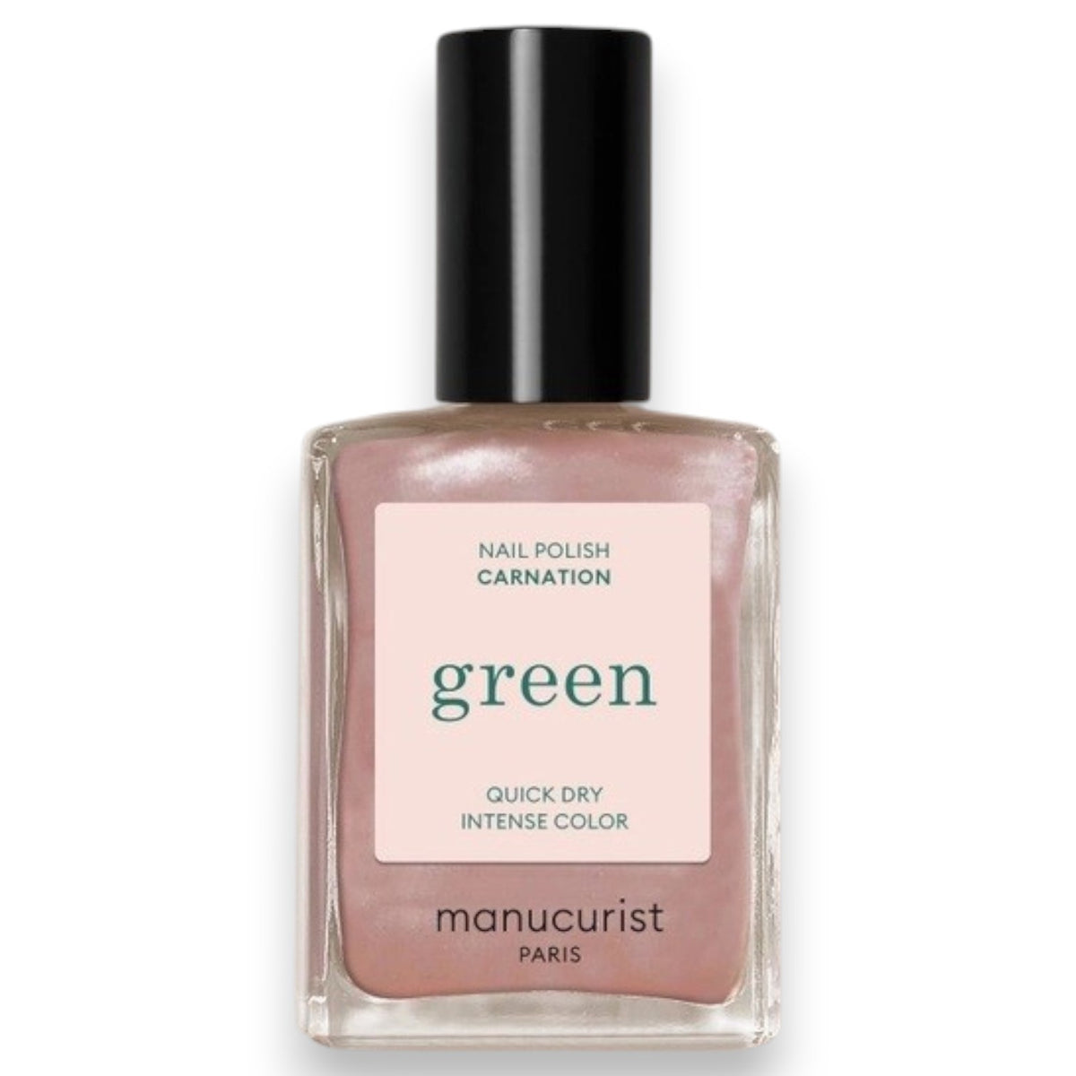 A hand with light pink polished nails holds a bottle of MANUCURIST - GREEN™ Nail Polish in Carnation by MANUCURIST INC, featuring a pearly pink vegan formula and the “green” label, resting against the pocket of light blue denim jeans.