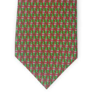 Introducing the BIRD DOG BAY PETER-BLAIR - SANTA HATS SILK TIE IN RED: a handcrafted silk tie adorned with a repeating pattern of festive red Santa hats, set against a vibrant red background. Handmade in New York, this spirited accessory is finished with an exclusive Peter-Blair woven label.