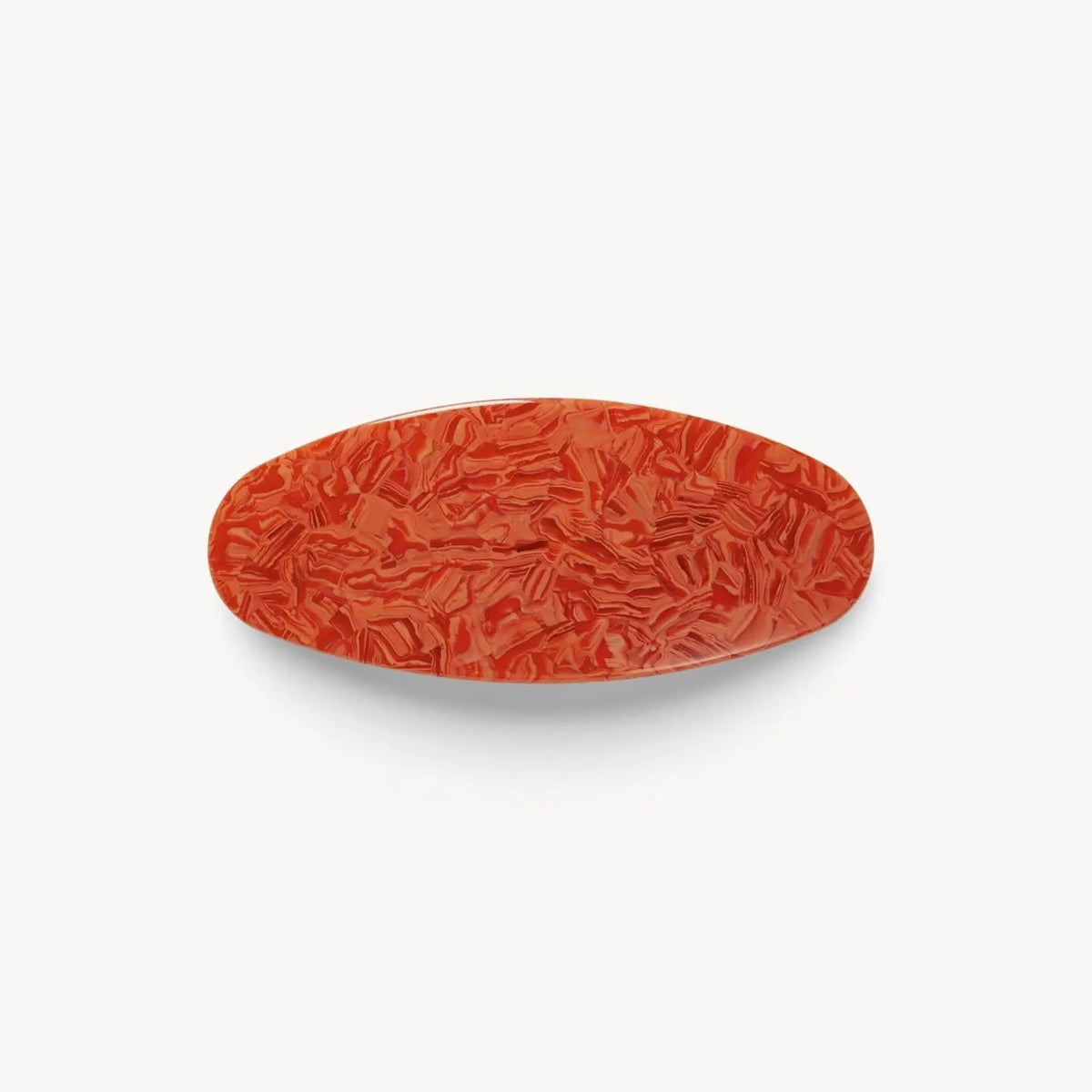 The MACHETE Jumbo Oval Barrette in Poppy features marbled orange Italian acetate with a glossy finish, shown on a plain white background.