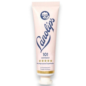 A pink tube labeled “LANOLIPS - 101 OINTMENT MULTIPURPOSE SUPERBALM” from LANOLIPS—an ultra-hydrating moisturizer—displays a blue logo with a sheep’s head and five gold stars, standing upright on a white background.