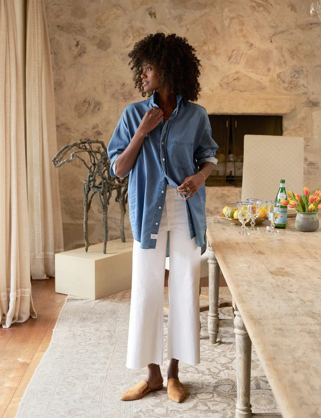 A pair of white high-waisted wide-leg Galway Gaucho jeans by FRANK &amp; EILEEN, featuring front and back pockets, belt loops, and a button and zipper closure. The FRANK AND EILEEN - GALWAY GAUCHO JEAN IN WHITE is displayed flat against a textured light background.