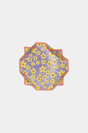 The EPICE - WARHOL BANDANA SCARF by EPICE features a purple base with a yellow floral pattern outlined in orange. It has crimped edges, an abstract Pop Art design, and vibrant hand-screen printed motifs on a plain white background.