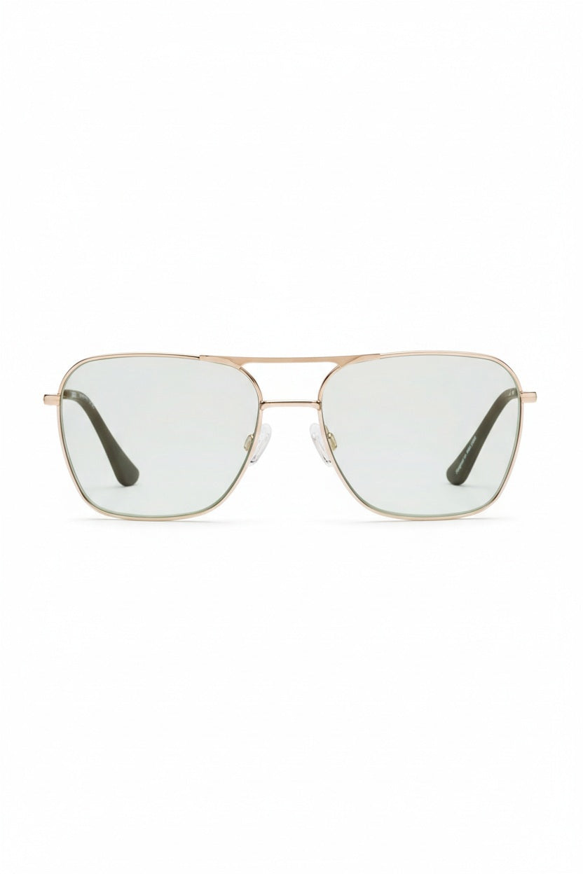 The CADDIS - HOOPER READERS feature square aviator-style frames made from lightweight gold metal, paired with scratch-resistant green-tinted lenses. Clear nose pads ensure comfortable wear, while the dark-finished arms elegantly contrast against a plain white backdrop.