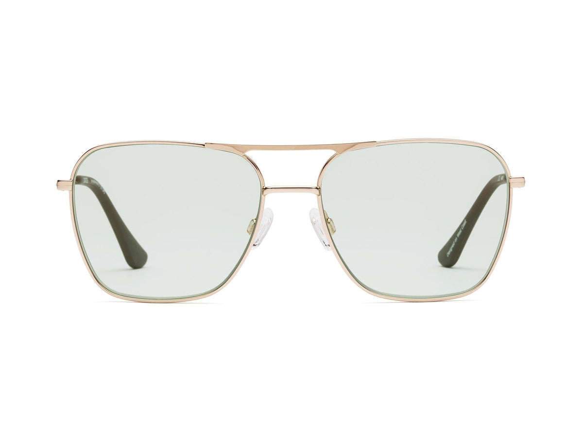 The CADDIS - HOOPER READERS feature square aviator-style frames made from lightweight gold metal, paired with scratch-resistant green-tinted lenses. Clear nose pads ensure comfortable wear, while the dark-finished arms elegantly contrast against a plain white backdrop.