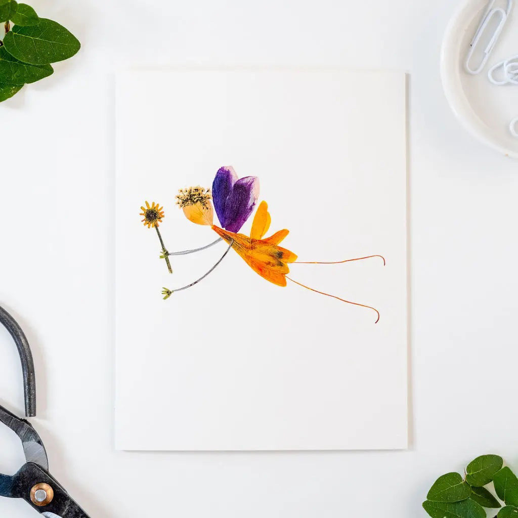 The PETAL PEOPLE PRESS - SPRITE CARD by PETAL PEOPLE PRESS features a fairy made from real dried flowers and petals with delicate drawn limbs on a white background—a charming pressed botanical card.