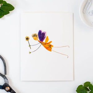 The PETAL PEOPLE PRESS - SPRITE CARD by PETAL PEOPLE PRESS features a fairy made from real dried flowers and petals with delicate drawn limbs on a white background—a charming pressed botanical card.