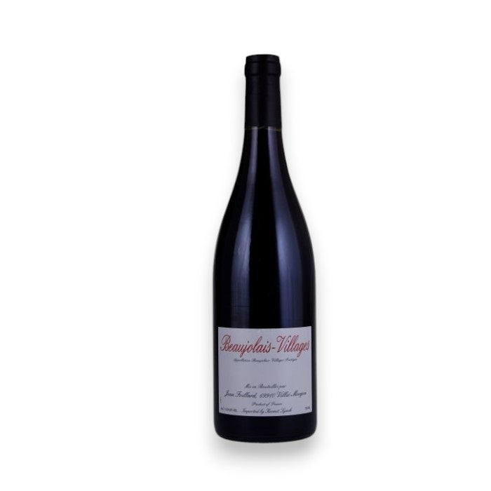 A dark glass wine bottle with a black cap and a white label reading "JEAN FOILLARD BEAUJOLAIS-VILLAGES 2023" by WINE: TRYON stands against a plain white background, capturing the classic Burgundy Gamay expression.