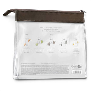 The MOLTON BROWN Refreshed Adventurer Body & Hair Carry-On Bag includes a clear bag with brown zipper, four color-labeled travel-size bath and shower gels, and a blue face wash tube on the left—a stylish set for travel from MOLTON BROWN.