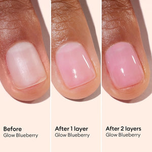 A pink serum drop labeled with its ingredients: raspberry extract (strengthens nails), AHAs (restore and harden), and sweet almond oil (nourishes). The text highlights that MANUCURIST - ACTIVE GLOW CARE POLISH by MANUCURIST INC is 85.5% plant-based—making it the ideal nail strengthener for achieving healthy, glass-like nails.