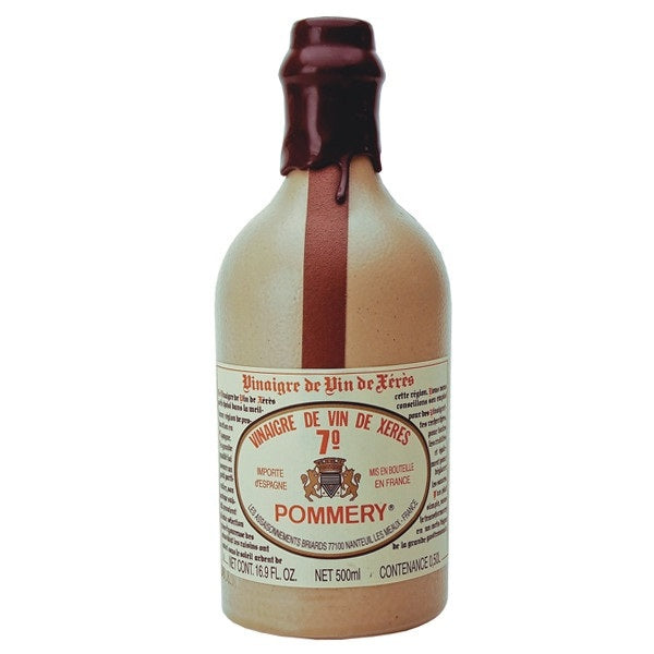 A 16-ounce ceramic bottle of THE FRENCH FARM POMMERY SHERRY VINEGAR, aged in oak casks and finished with a red wax seal, features a vintage-inspired label in both French and English. Crafted using traditional methods, this sherry wine vinegar contains 7% acidity for an authentic flavor.