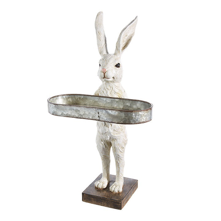 The RAZ IMPORTS &quot;RABBIT WITH TRAY&quot; is a resin decorative sculpture of a white rabbit with tall ears and detailed fur, standing upright on a square wooden base and holding an oval metal tray for decoration.
