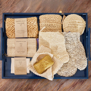 The BAUDELAIRE HORSE HAIR WASH MITT, a folded, textured exfoliating mitt inspired by the Turkish hammam tradition, appears in beige or light brown against a plain white background.