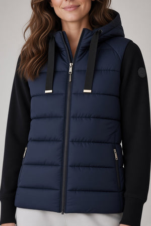 SAVE THE DUCK - PRISKA PUFFER JACKET IN BLUE BLACK hooded hybrid jacket featuring a dark blue quilted body, black sleeves, and a front zipper for transitional weather.