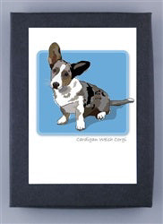 Introducing PAPER RUSSELLS - CORGI NOTE CARDS: a rectangular art piece in a dark frame, showcasing an illustration of a Cardigan Welsh Corgi puppy. The adorable pup features one ear up and one ear down, with black, brown, and white fur on recycled paper. Set against a light blue square background, the text below reads "cardigan welsh corgi". Proudly made in the USA by PAPER RUSSELLS.