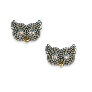 The MIGUEL ASES - OWL STUD EARRINGS WITH SWAROVSKI CRYSTAL by MIGUEL ASES, INC. are handcrafted in America and feature owl shapes with sparkling flower-like Swarovski crystal eyes, arranged on a white background.