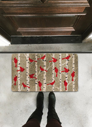 Rectangular CARDINALS IN BIRCH DOORMAT by ABBOTT, featuring a pattern of red cardinals perched on birch tree branches.