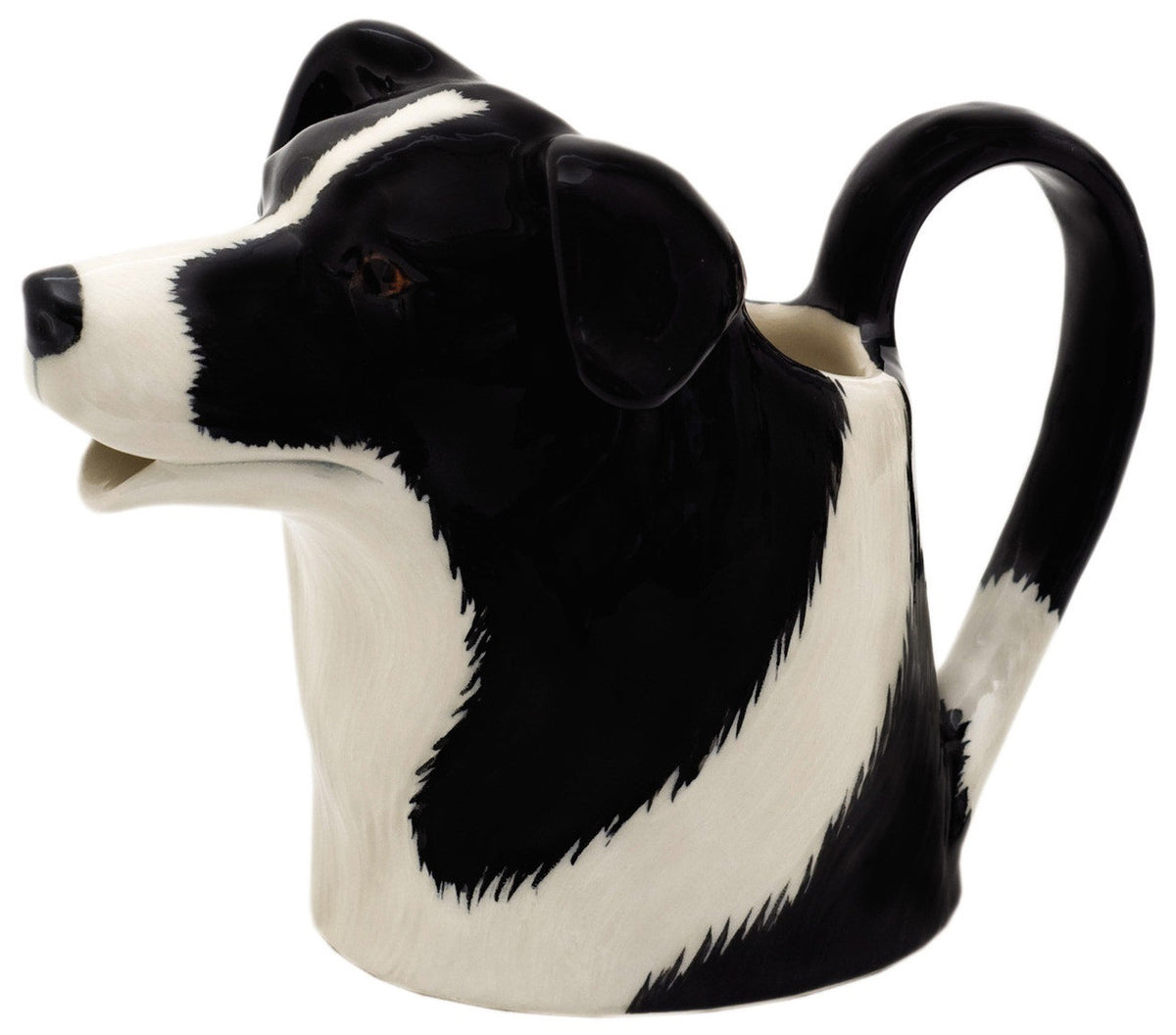 The QUAIL DESIGNS QUAIL CERAMICS Border Collie Jug is a handpainted stoneware jug shaped like a black and white dog, with the spout as the dog&#39;s open mouth, shown on a plain white background.