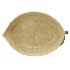 The CREATIVE COOP HAND-PAINTED STONEWARE LEMON SHAPED BOWL, LARGE features a textured yellow finish with a green leaf accent, making it a perfect decorative citrus bowl.
