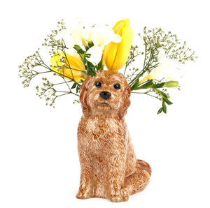 The QUAIL DESIGNS QUAIL CERAMICS Cockapoo Dog Flower Vase features a hand-painted brown, curly-haired dog with black eyes and nose, sitting upright against a plain white background.